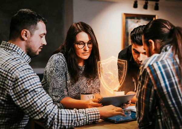 Team collaborating on cybersecurity awareness strategy